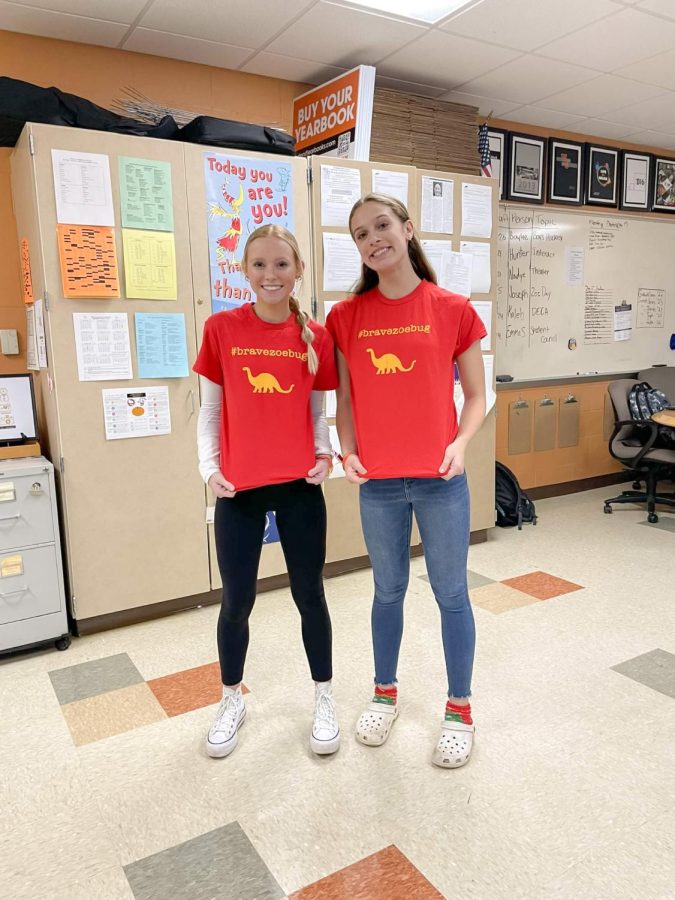 Students Gabi Bauer and Maria Cannon show their support for the Coder family.