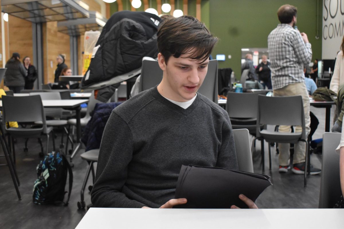 Jon Iliff '24 works on his presentation for State Forensics.